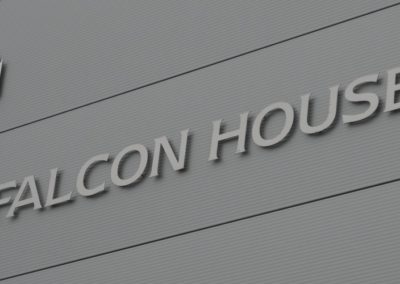 Logo of the bulding - Falcon Business Centre in silver with a bird in the corner