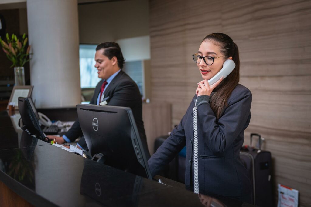 2 receptionist.  One on the phone and one working on the computer