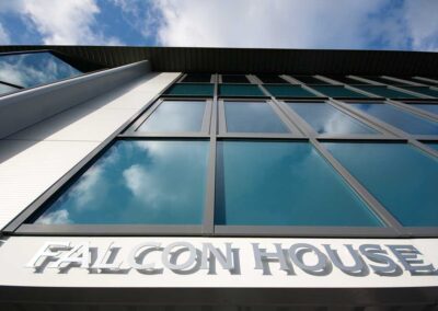Outside of the building with the words Falcon Business Centre and looking up at the windows