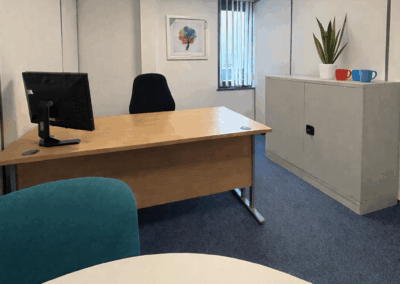 2 desk external office with a desk and meeting table